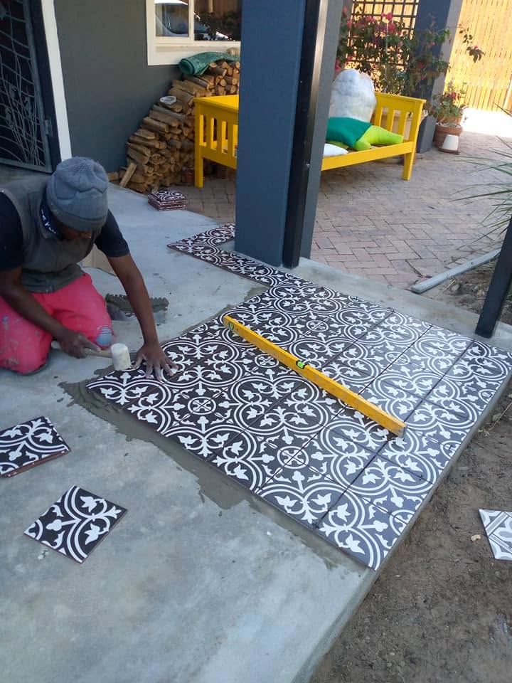 Floor tiling in progress — Majors Builders
