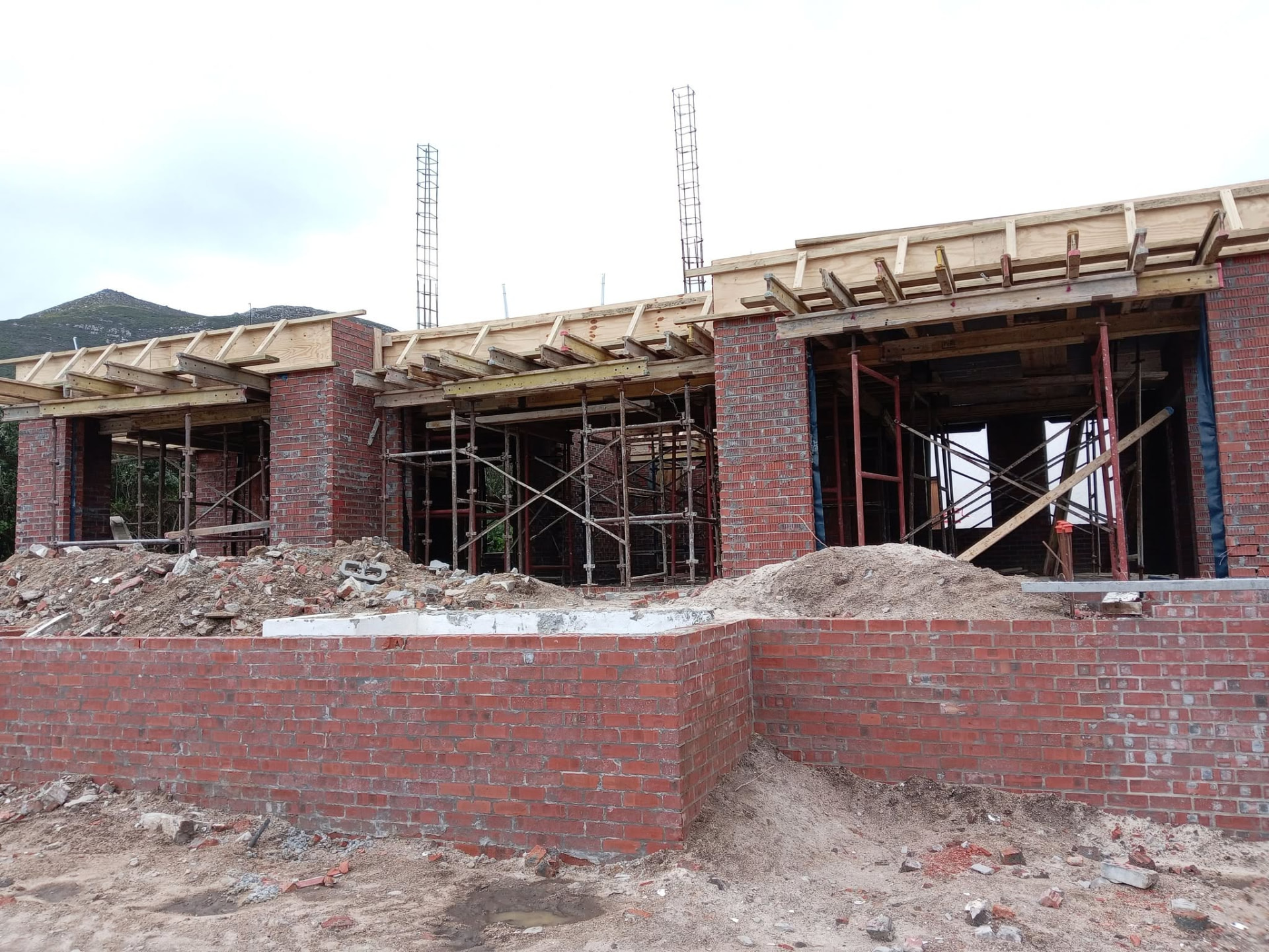 Brick walls with roof timber — Majors Builders