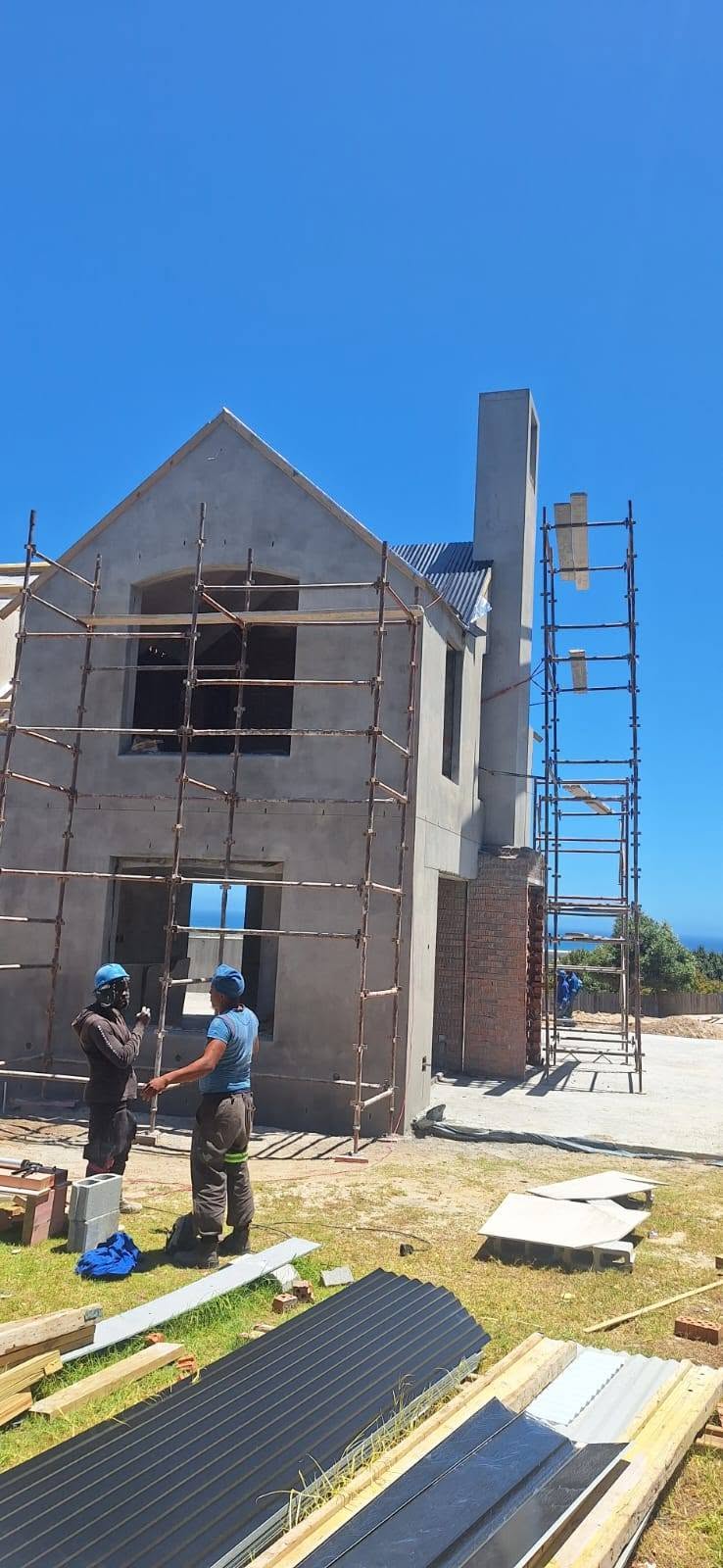 Plastered exterior with site team — Majors Builders